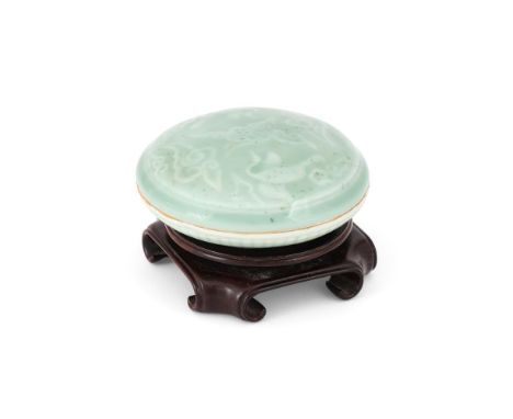 A CHINESE CELADON-GLAZED SEAL PASTE BOX AND COVER QING DYNASTY, 18TH-19TH CENTURY Decorated in white with two flying cranes i