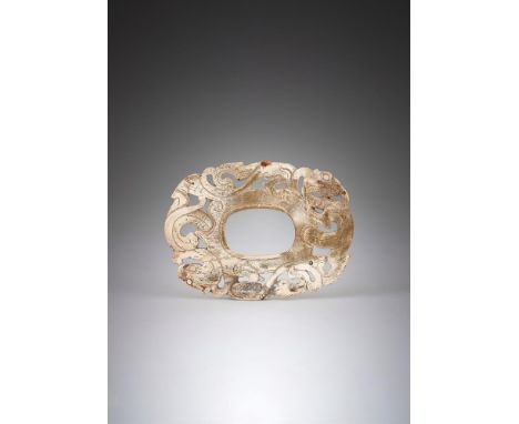 A CHINESE CALICIFIED 'CHICKEN BONE' JADE PLAQUE WARRING STATES-HAN PERIOD (475 BC-220 AD) Of oval shape, carved in openwork w