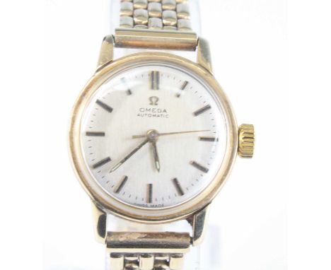 A vintage lady’s 9ct gold Omega wristwatch, having signed silvered dial with baton markers, automatic movement, 22mm, on 9ct 