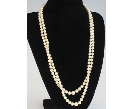 A cultured pearl double-string necklace, the graduated pearls on a knotted string, the largest dia. approx 8.5mm, to a 9ct go