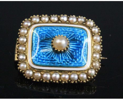 A Victorian yellow metal, guilloche enamel and seed pearl set mourning brooch, having an open back and safety pin, unmarked b