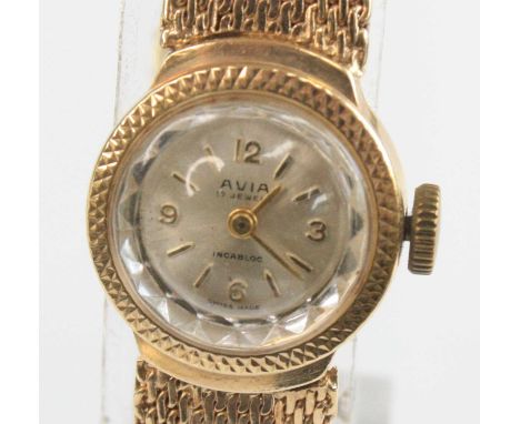 An Avia lady's 9ct gold cased bracelet watch, having a signed silvered dial with quarter Arabic numerals, manual wind movemen