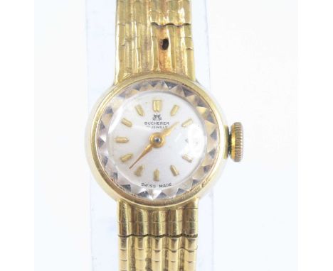 A Bucherer lady's yellow metal dress watch, stamped 750 and tests as approx 18ct, having a signed champagne dial with baton m