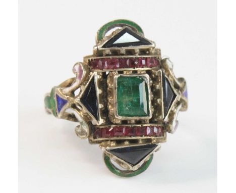 An early 19th century white metal dress ring, having a centre 5.35 x 4.25mm rectangular emerald within a border of four 6.2 x