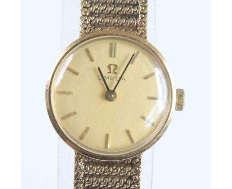 A vintage lady's Omega 9ct gold cased wristwatch, having a signed champagne dial with baton markers, manual wind movement, in