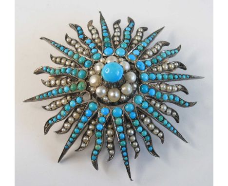 A circa 1900 yellow metal, turquoise and seed pearl set sunburst brooch, arranged as alternating rays set with graduated ston