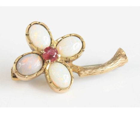 A modern 9ct gold, ruby and opal set flower head brooch, the four-claw set round cut ruby weighing approx 0.15 carats, within