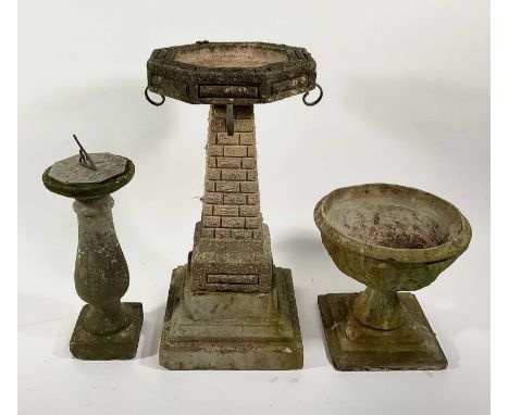 Garden sculpture: a large modernist birdbath above a brick effect column, plinth, with an acanthus urn planter and baluster b
