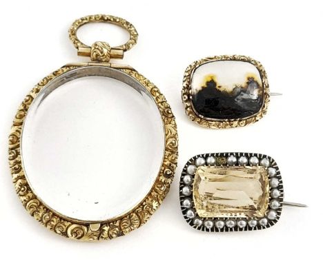 A late Georgian gilt metal locket pendant, a late Georgian moss agate landscape brooch, together with a citrine and imitation