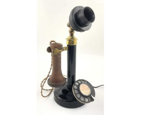 A GPO type 150 candlestick telephone, circa 1920's, black bakelite mouthpiece, vulcanite earpiece, braided flex, rotary dial,