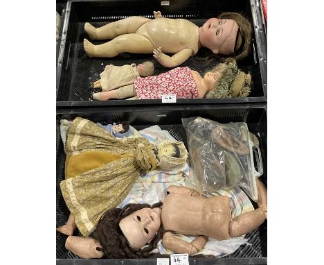 A collection of late 19th and 20th century dolls, including a wooden Victorian painted peg doll, German examples, impressed m