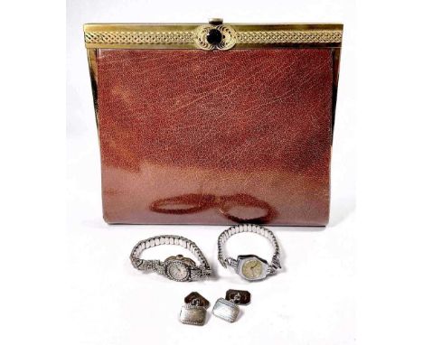 A crushed brown morroco gilt metal mounted manicure set, in the form of a clutch bag, circa 1960s, with fitted interior, 18cm