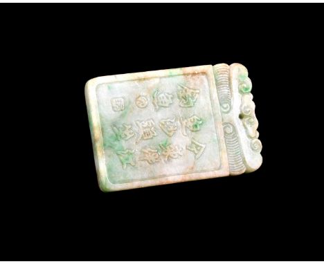 A Chinese carved jade pendant, rectangular form, one side with a verse