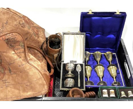 A hold-all bag together with a boxed Christening set, leather-cased binoculars, collectable ceramic thimbles etc. (1 tray)