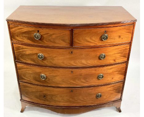 A late 18th or 19th century mahogany bow fronted chest of drawers, plane top with reeding, two short over three long, metal h