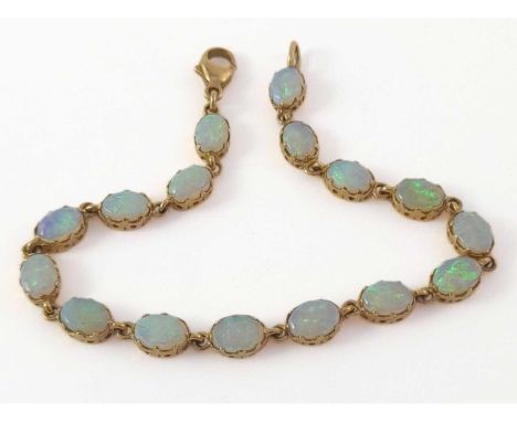 A 9ct gold opal line bracelet