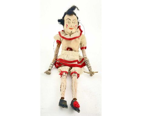 An early 20th century fully articulated, hand-painted wood clown puppet, of Commedia Dell'Arte type in custom hand-made cloth