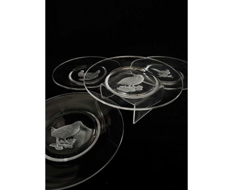 A set of four Val St Lambert glass plates, intaglio moulded game birds to the centre of each, incised marks, 20cm diameter (4
