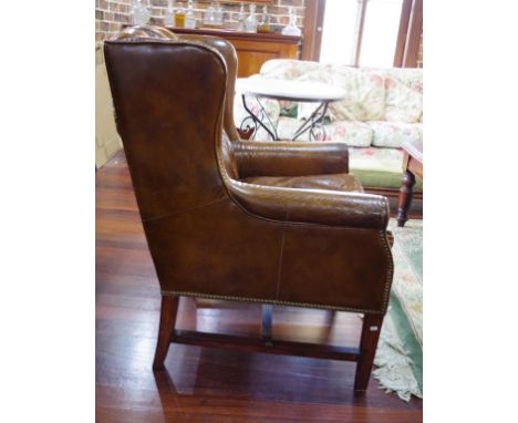 Good antique style leather arm chair button backed and stretcher base.