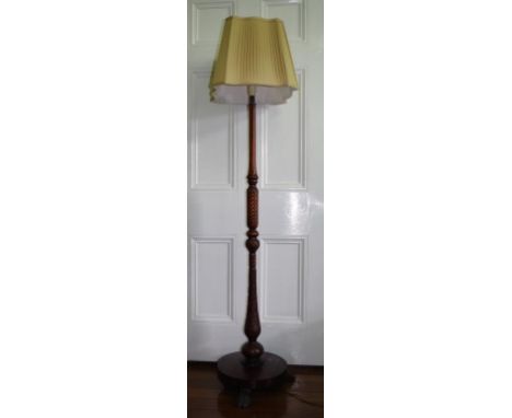 Good antique mahogany standard lamp with reeded column, lion paw feet.