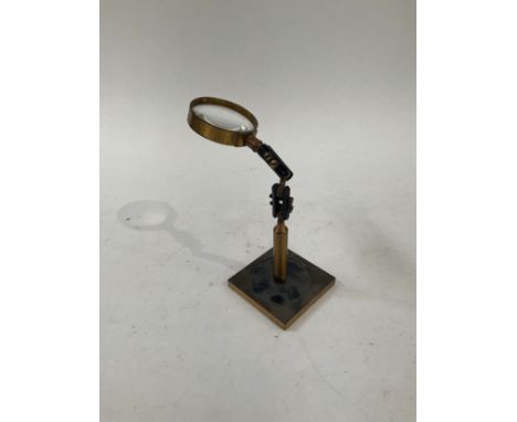 A clock makers magnifying glass with articulated arm 