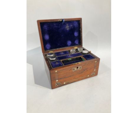 A Victorian ladies travelling vanity case and jewellery box in rosewood with mother-of-pearl inlay, within the lid is a "secr