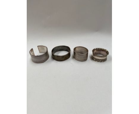 A silver napkin ring, a plated napkin ring and two silver bangles (4) 