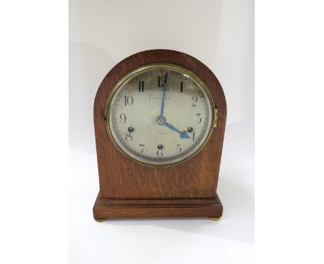 A Mappin &amp; Webb London early 20th Century Westminster chime mantel clock striking on gong in light oak case.  29.5cm tall