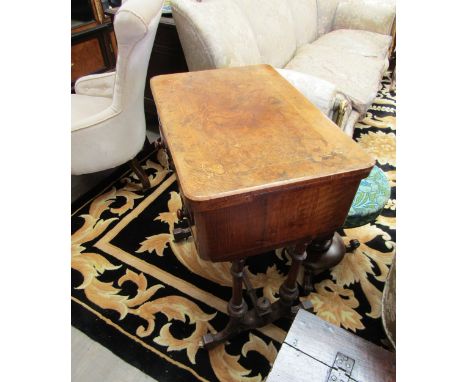 A Victorian walnut games table, the fold over top with chequerboard, backgammon and cribbage board, over a single long and tw