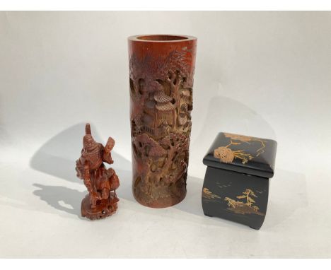 A Japanese bamboo brush pot with images of monkeys, ox and figures, a Japanese lacquered tea caddy and a Japanese wood carvin