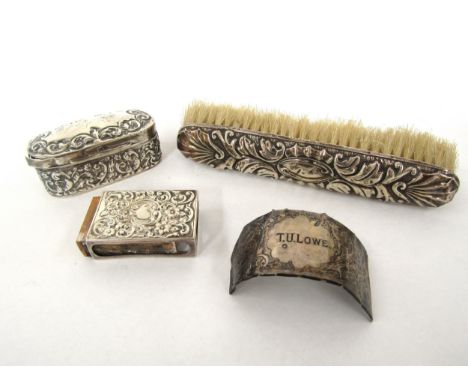 A silver William Aitken embossed ring box, lid spilt, match box holder, brush and silver collar(3) 