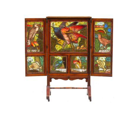 IN THE MANNER OF GEORGE EDWARD COOK (1844-1914): An Arts and Crafts stained and leaded glass three-fold fire screen, seven pa