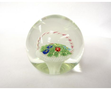A vintage glass paperweight, probably Murano with basket of Millefiori flowers and Murrine leaves. Unmarked. 8cm diameter x 7