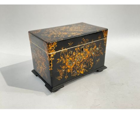 A 19th Century black, paper-mache double tea caddy, lavishly but delicately decorated in gilt and colours with flowers and le