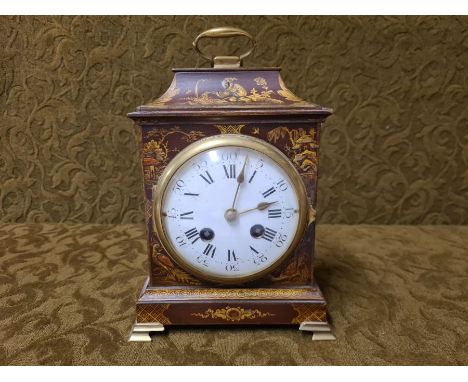 Early 20th century wooden Chinoiserie mantle clock, brown gilt with red highlights and Samuel Marti French movement with gilt
