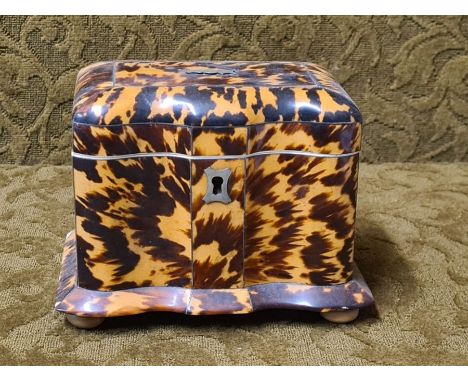 Small tortoiseshell tea caddy shaped form, missing a foot, small losses and hinge damage, 147mm x 102mm x 110mm.