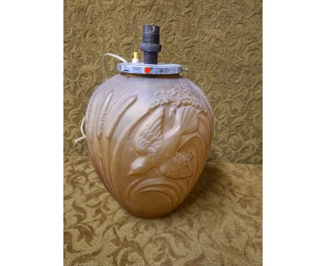 1930's Art Deco amber glass lamp base, embossed with birds and rushes, standing 32cm tall.