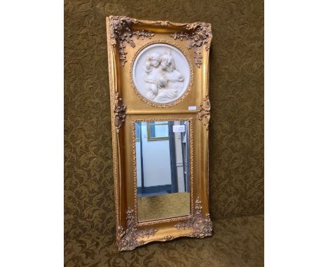 Modern gilt wall hanging mirror with a marble panel of 2 young girls.