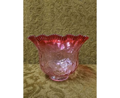 Cranberry glass lamp shade with crimped and flared rim.