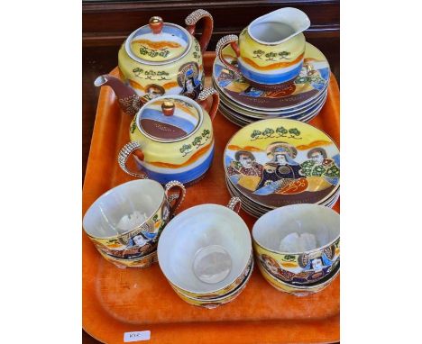 Japanese luster tea service including teapot, sugar bowl and milk jug (1 cup cracked).