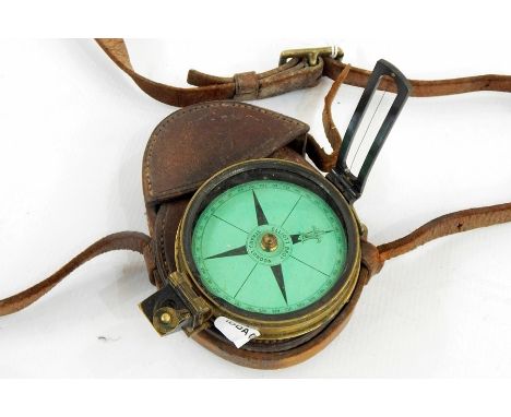 19th century brass-cased compass by Elliot Brothers of London with green-coloured dial, prismatic sight, in leather carrying 