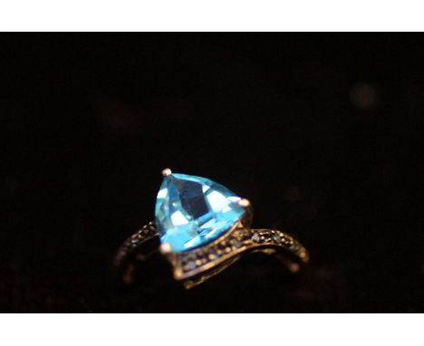 9ct White Gold Dress Ring with Light Blue Stone