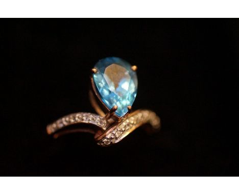 9ct Gold Dress Ring with Large Light Blue Stone