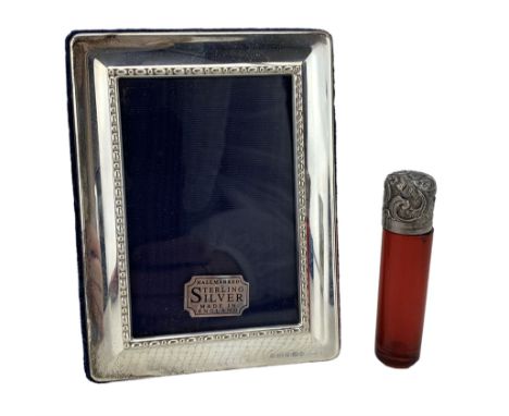 Modern silver photograph frame with millenium mark by Carrs of Sheffield 12cm x 9cm  and ruby glass scent flask with silver c