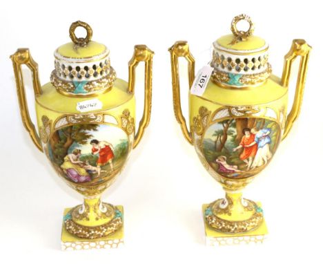 A pair of Helena Wolfsohn, Dresden porcelain twin handled urn shapes vases and covers, circa 1900, decorated with classical f