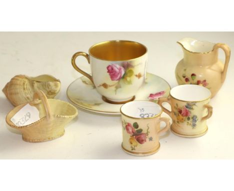A Royal Worcester porcelain matched miniature teacup and saucer, 1924 and 1926, painted with pink roses, printed marks; and a