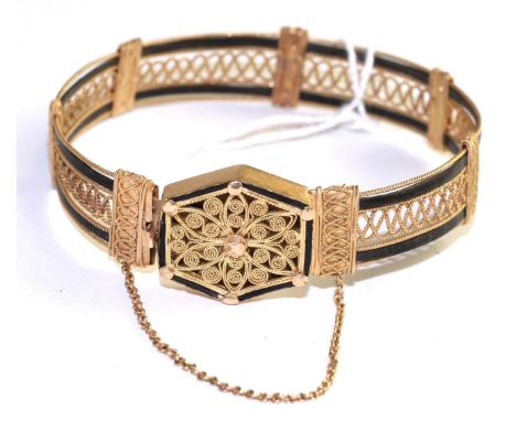 A Victorian cannetille and elephant hair bangle, two bands of elephant hair to a cannetille frame bangle, to a conforming hex