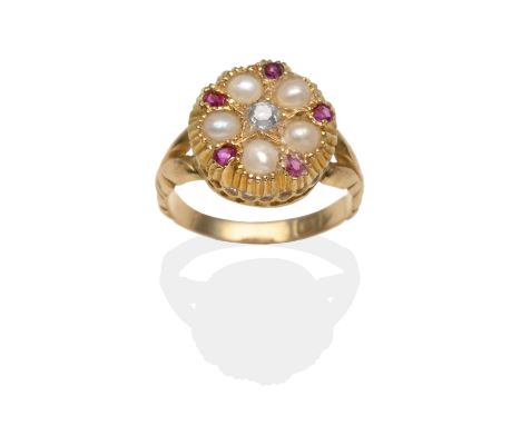 An 18 carat gold diamond, ruby and split pearl ring, a yellow circular bezel inset with a central old cut diamond within a bo