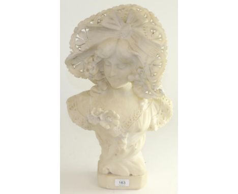 A Palechi: an alabaster bust of an Art Nouveau maiden, wearing a ribbon tied bonnet and lacy dress with flower button hole, o