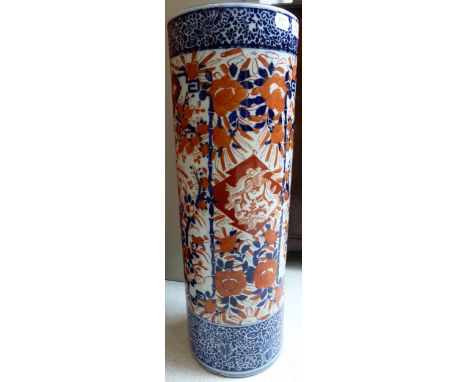 An Imari porcelain stick stand, Meiji period, typically decorated with birds and foliage, 62cm high